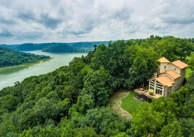 892 Cunningham Lane Baxter, TN 38544 - Photo 1 of 28 an aerial view of a house with garden space and lake view
