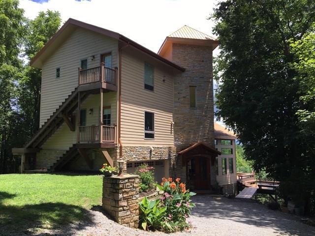 892 Cunningham Lane Baxter, TN 38544 - Photo 21 of 28 a front view of a house with a yard