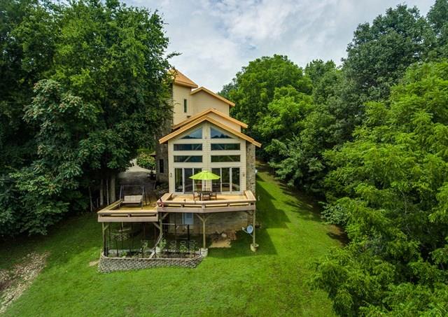 892 Cunningham Lane Baxter, TN 38544 - Photo 23 of 28 a view of a house with a yard table and chairs