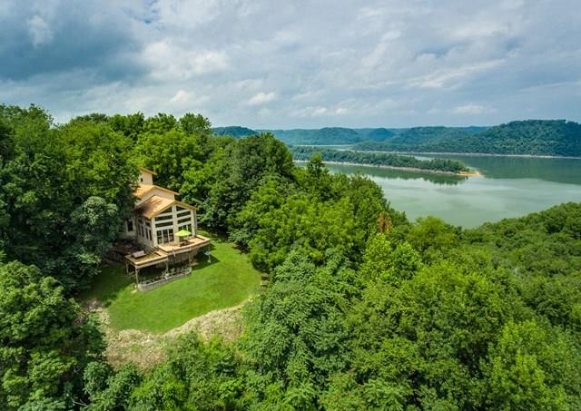 892 Cunningham Lane Baxter, TN 38544 - Photo 24 of 28 a aerial view of a house with a yard and lake view in back