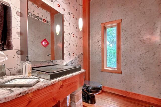 892 Cunningham Lane Baxter, TN 38544 - Photo 8 of 28 a bathroom with a granite countertop sink and a mirror