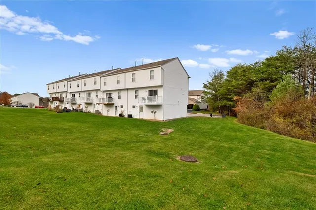a view of a big house with a big yard
