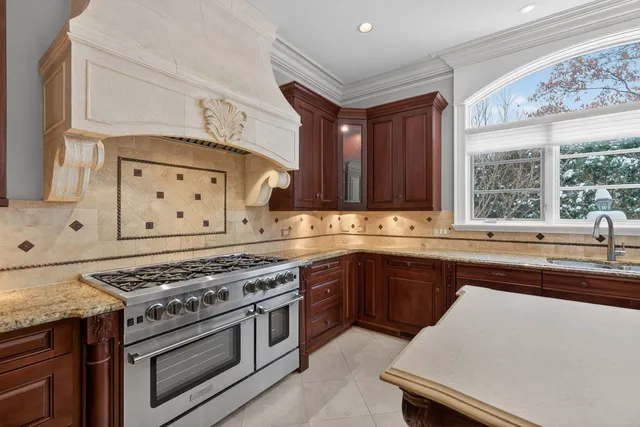 a kitchen with a stove a sink and a microwave