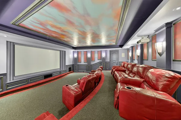 a living room with furniture and floor to ceiling window