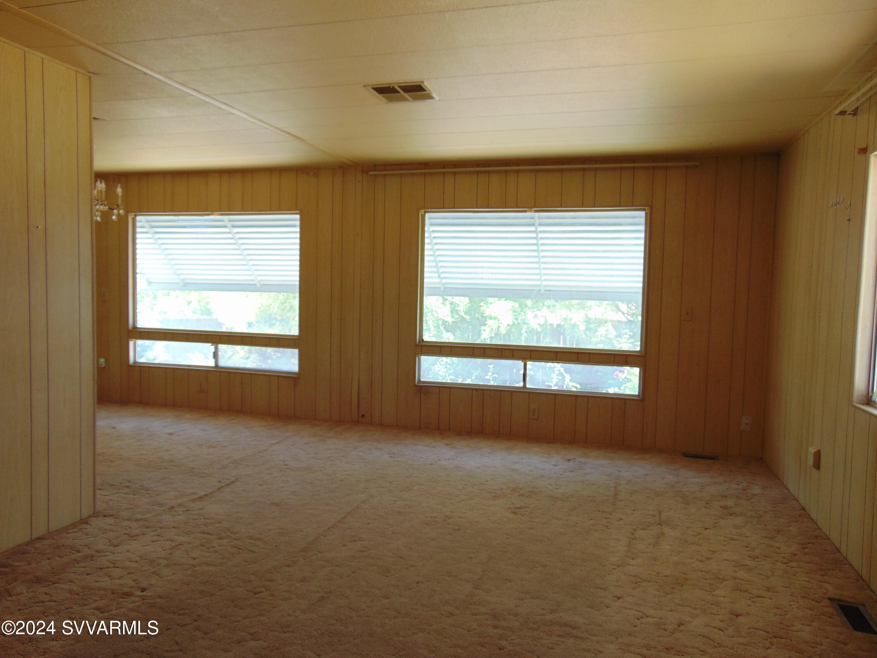 4665 Quail Hollow Road Rimrock, AZ 86335 - Photo 13 of 21 a view of an empty room with a window