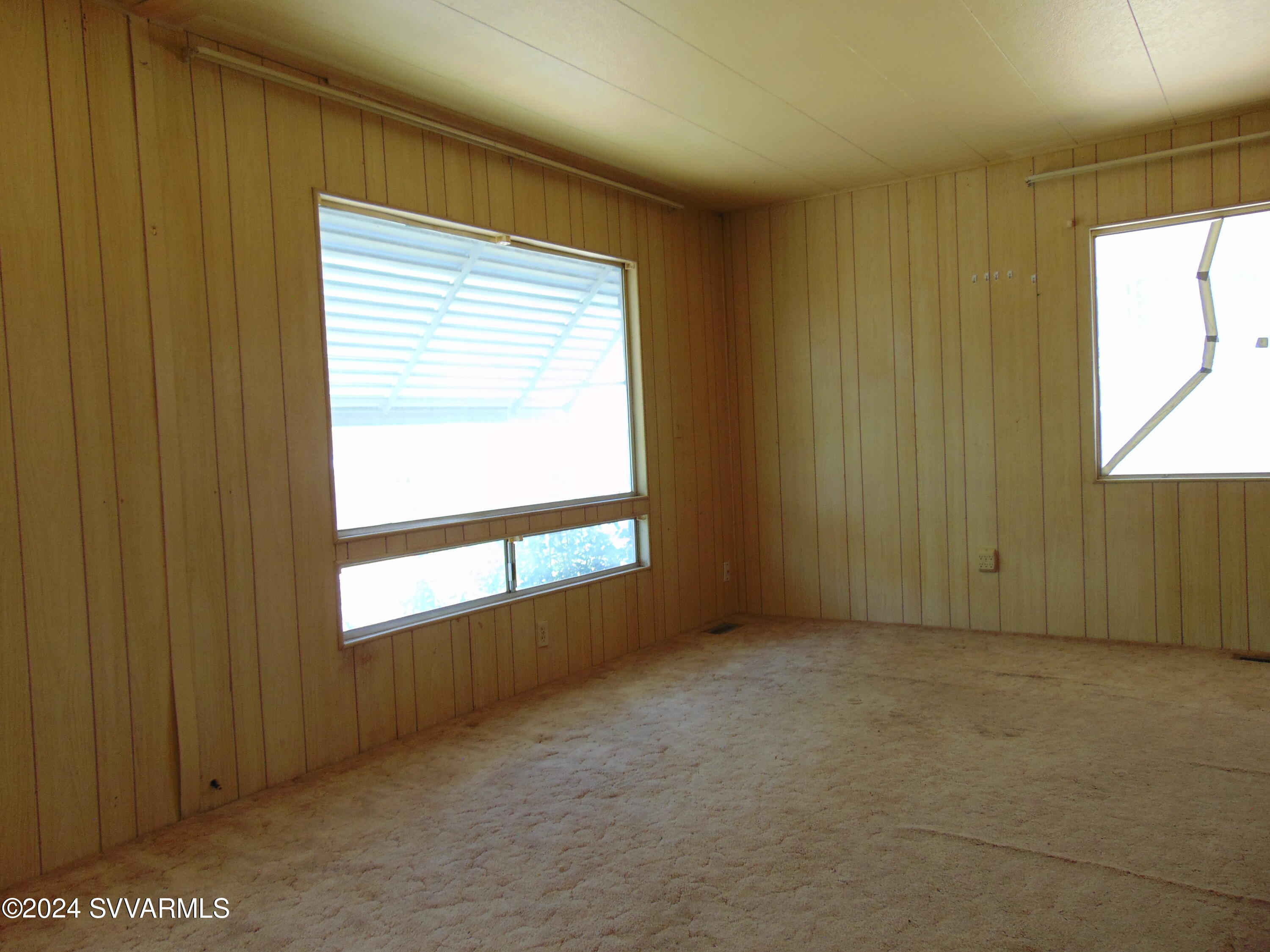 4665 Quail Hollow Road Rimrock, AZ 86335 - Photo 15 of 21 a view of an empty room with a window