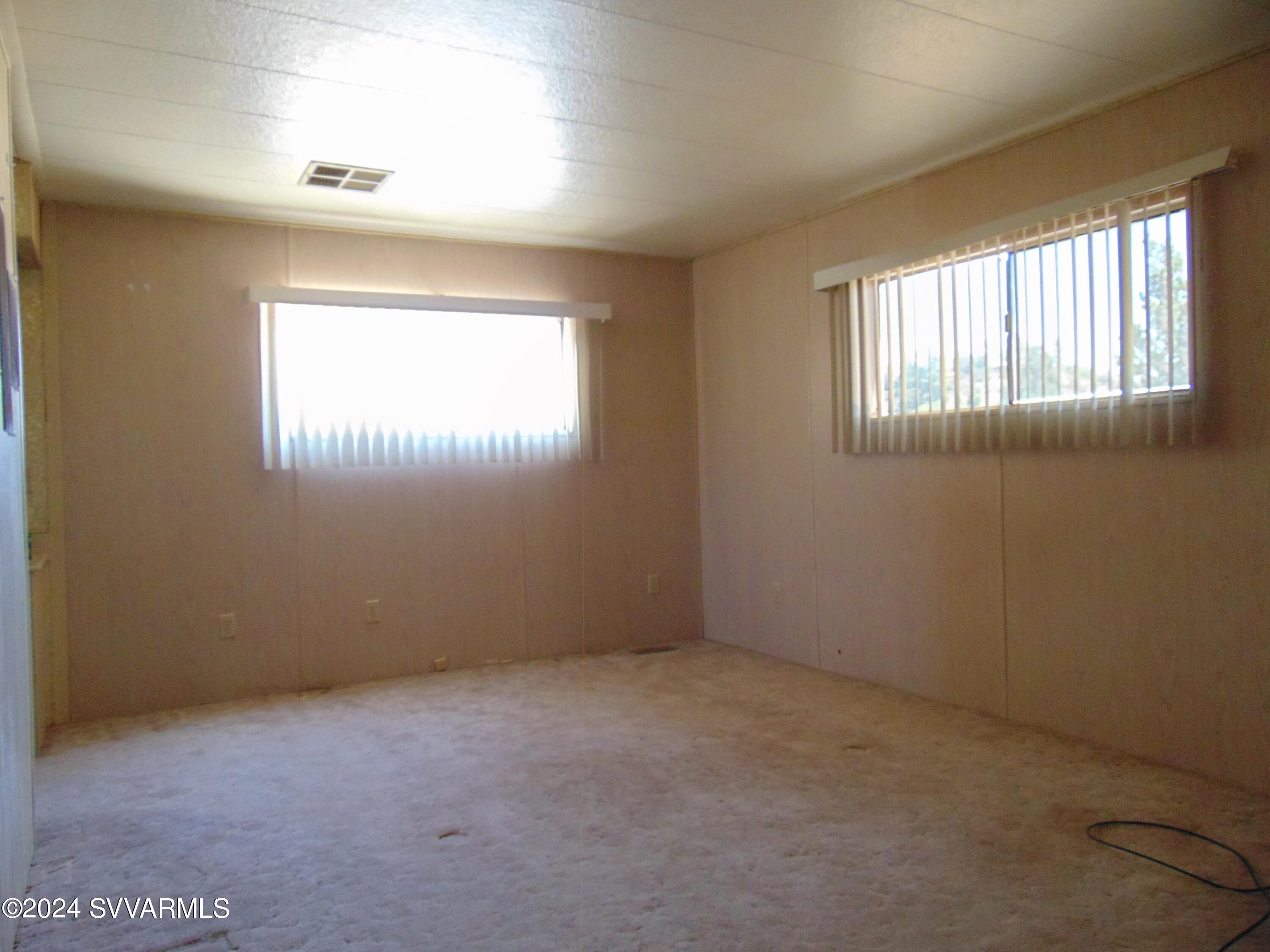 4665 Quail Hollow Road Rimrock, AZ 86335 - Photo 18 of 21 an empty room with a window