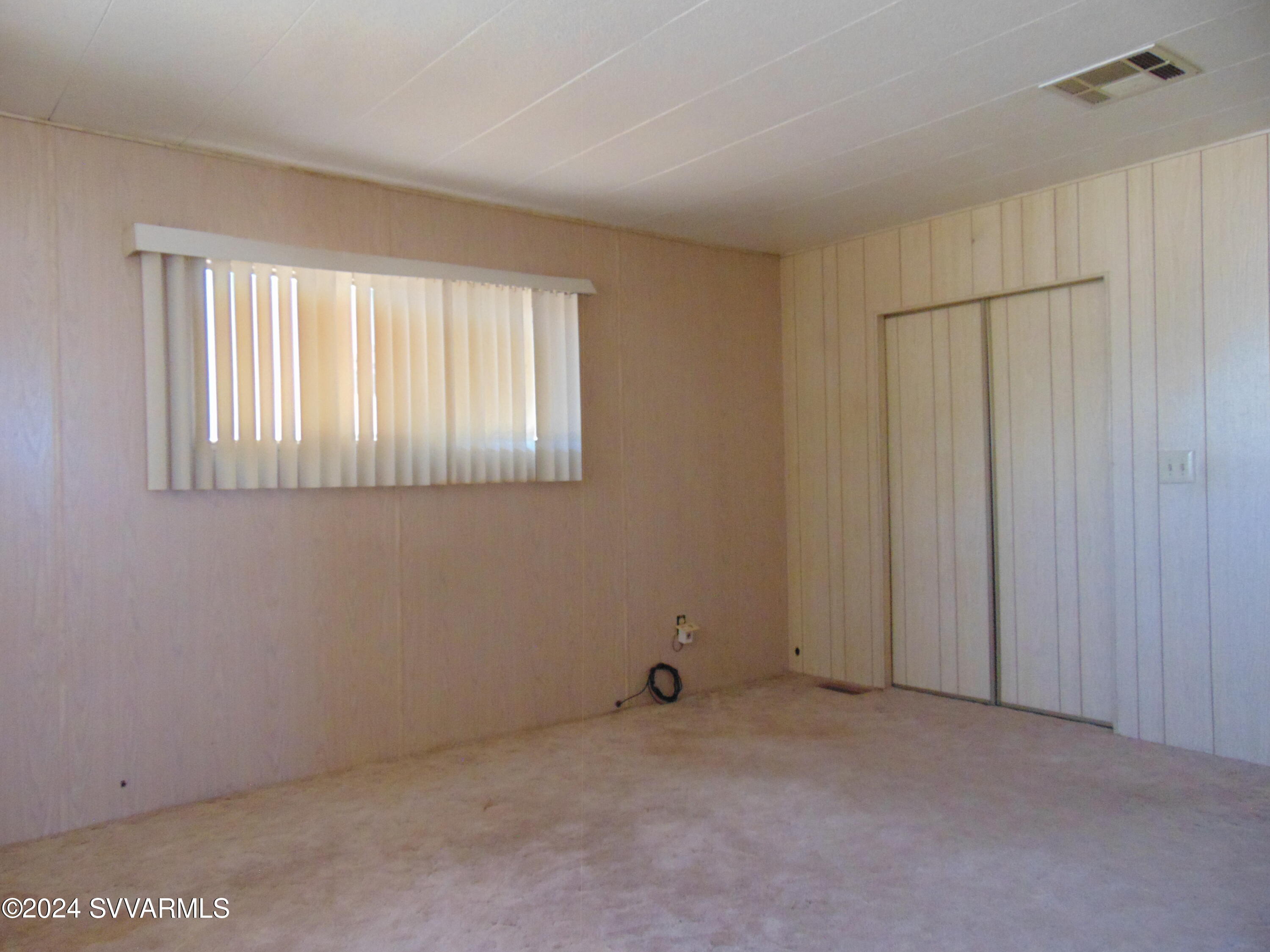 4665 Quail Hollow Road Rimrock, AZ 86335 - Photo 19 of 21 a view of an empty room with a window