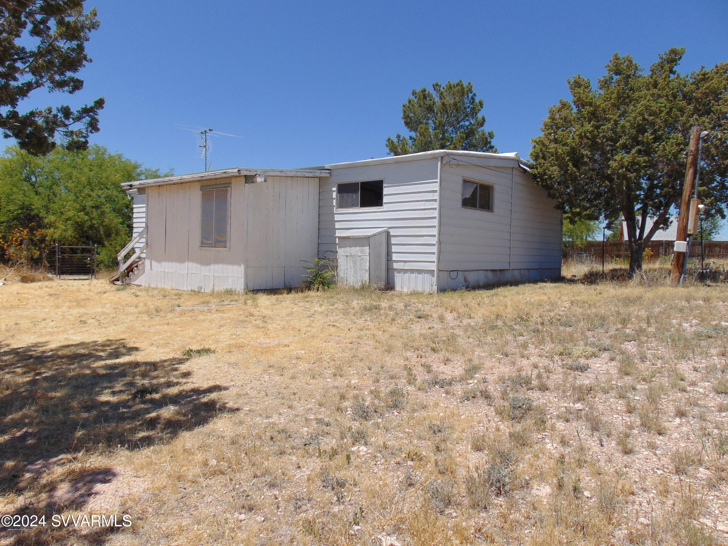 4665 Quail Hollow Road Rimrock, AZ 86335 - Photo 3 of 21 a front view of a house with a yard