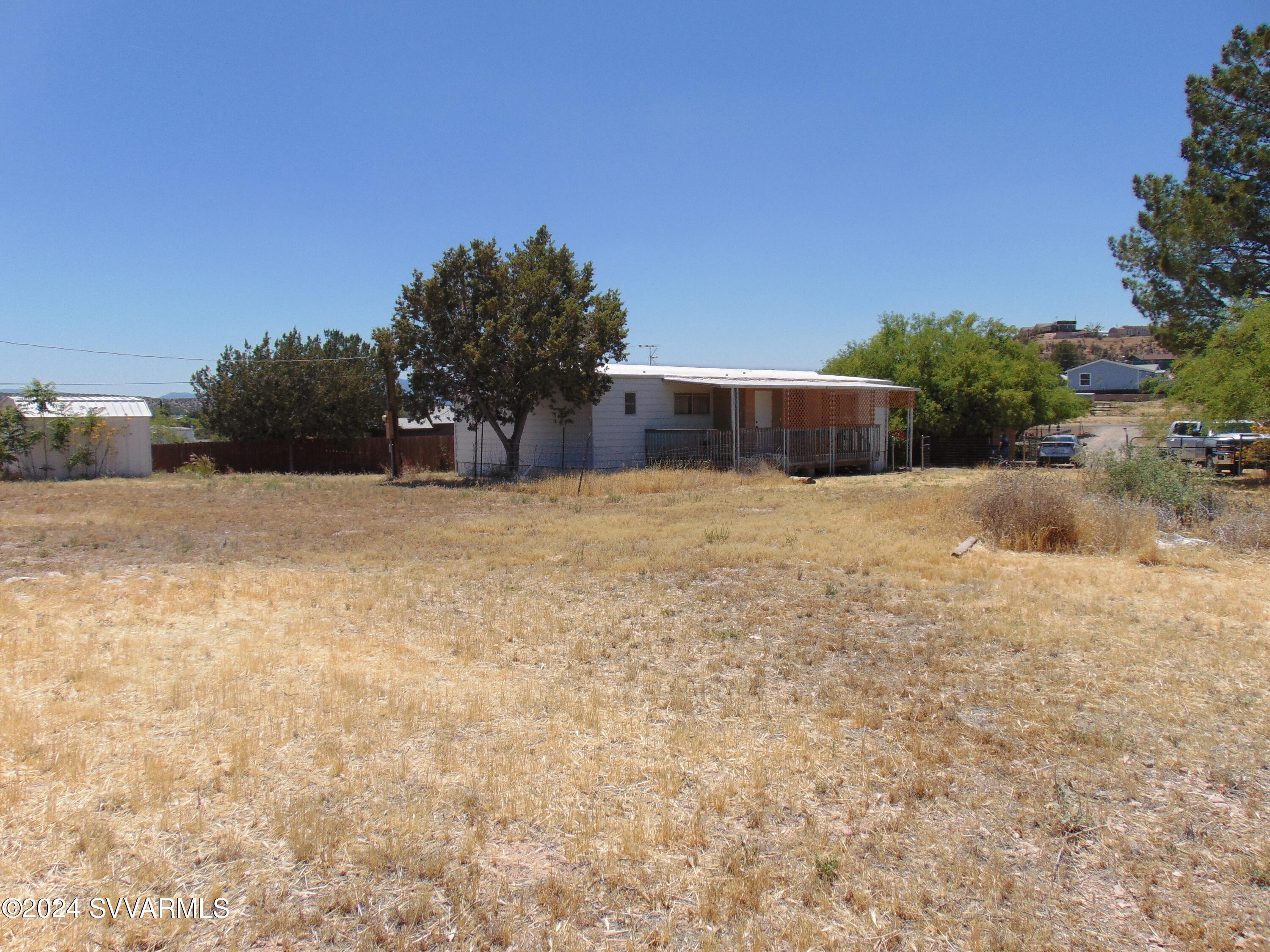 4665 Quail Hollow Road Rimrock, AZ 86335 - Photo 5 of 21 a view of backyard with tall trees