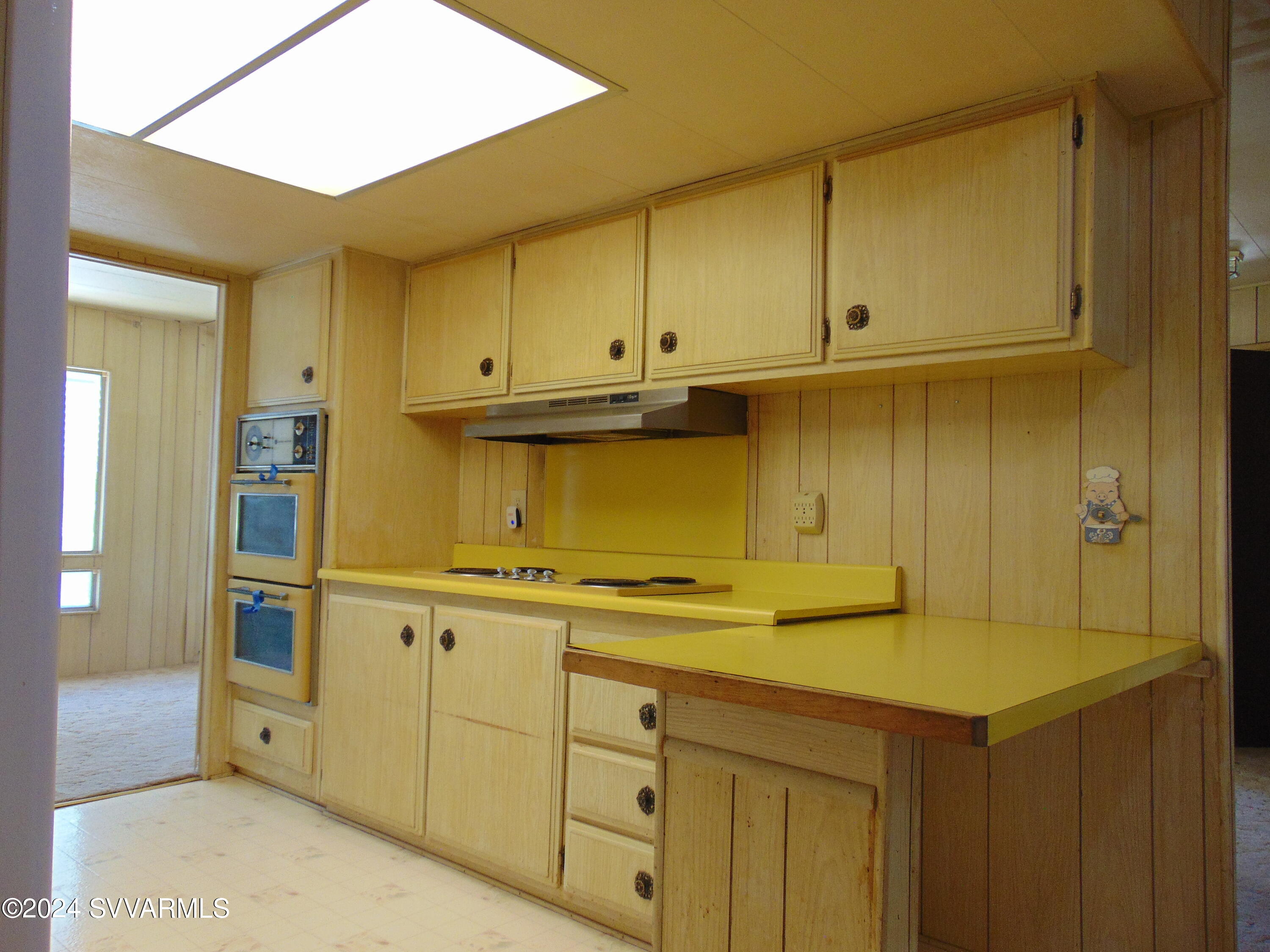 4665 Quail Hollow Road Rimrock, AZ 86335 - Photo 6 of 21 a kitchen with white cabinets and a sink
