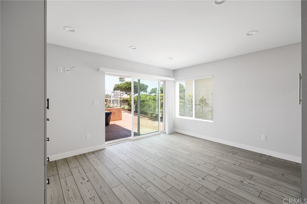 5 Clipper Road, Unit A Rancho Palos Verdes, CA 90275 - Photo 12 of 18 a view of an empty room with wooden floor and a window