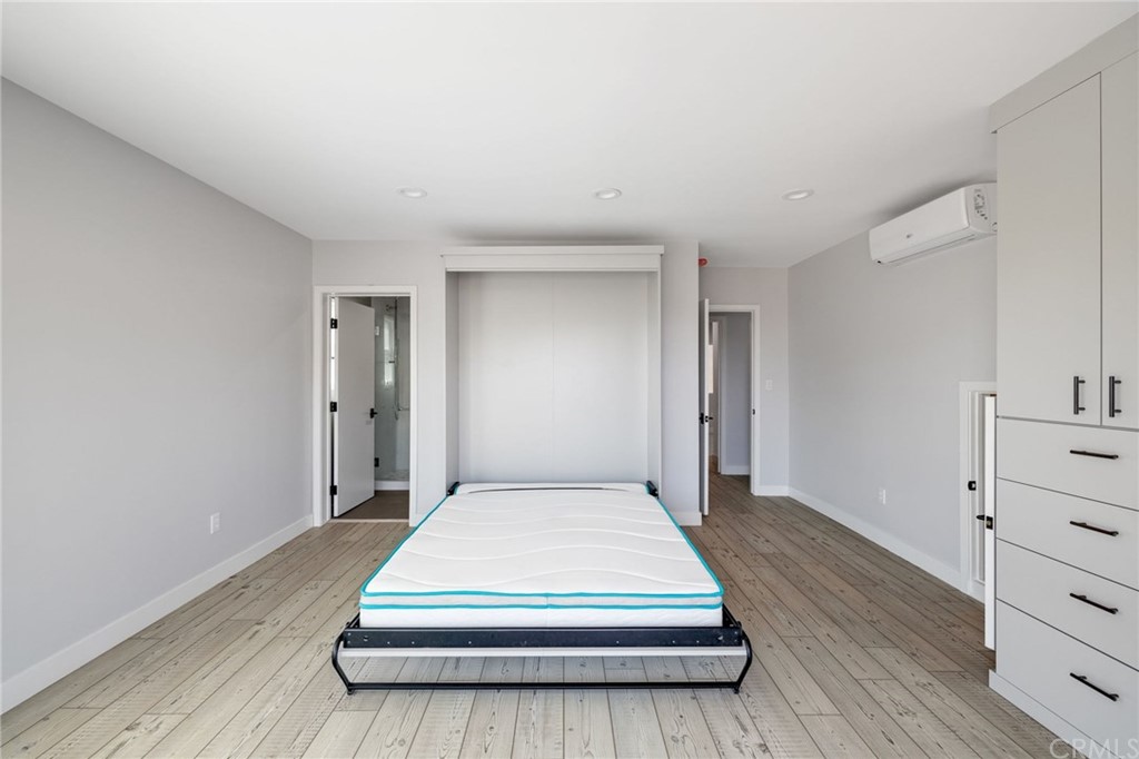 5 Clipper Road, Unit A Rancho Palos Verdes, CA 90275 - Photo 14 of 18 a bedroom with a bed and a dresser