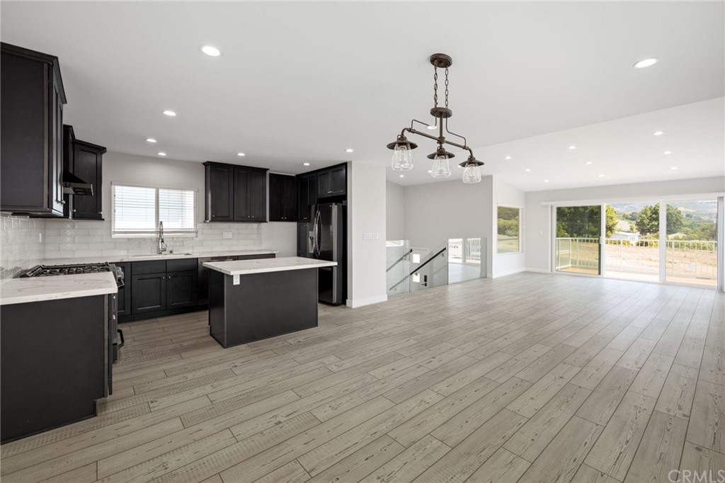 5 Clipper Road, Unit A Rancho Palos Verdes, CA 90275 - Photo 4 of 18 a large kitchen with stainless steel appliances granite countertop a lot of counter space and wooden floors