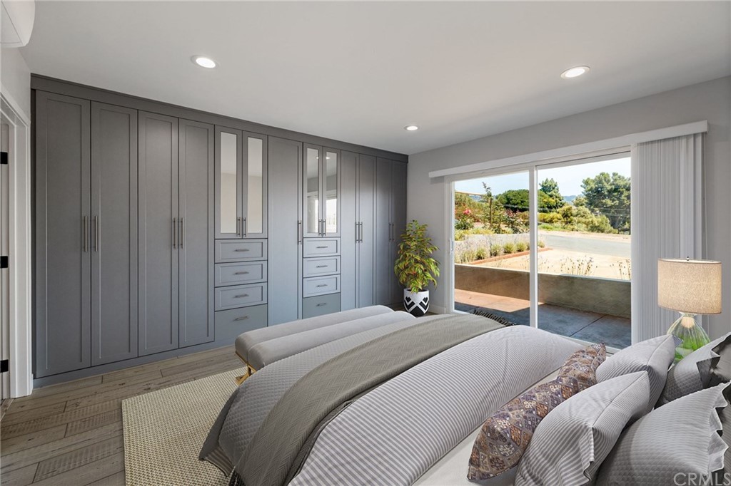 5 Clipper Road, Unit A Rancho Palos Verdes, CA 90275 - Photo 6 of 18 a bedroom with a balcony a bed and a lamp