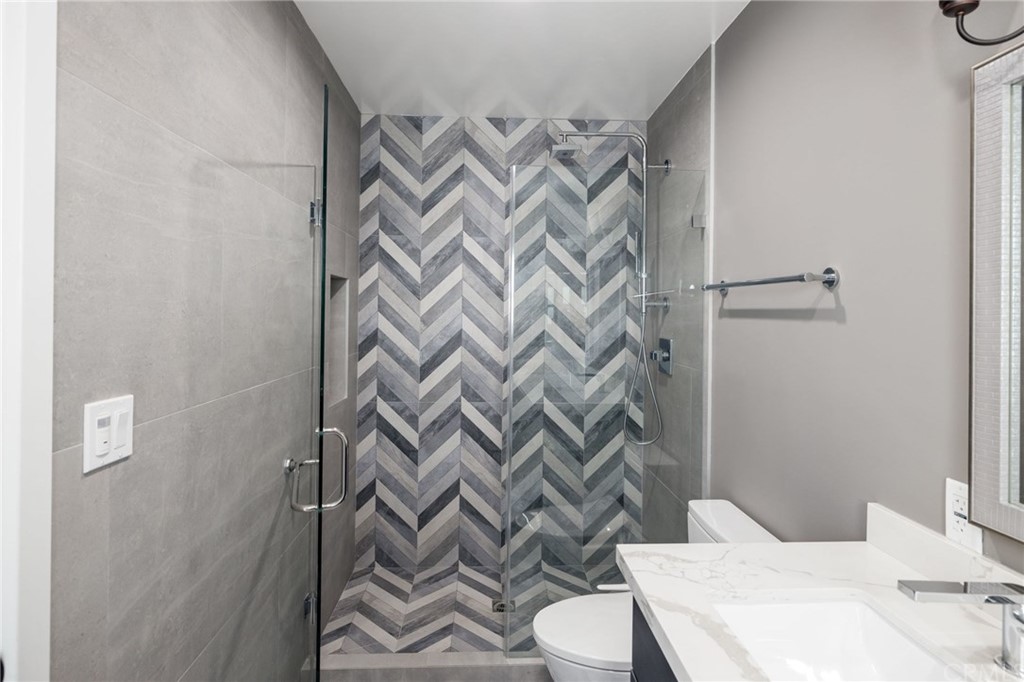 5 Clipper Road, Unit A Rancho Palos Verdes, CA 90275 - Photo 8 of 18 a bathroom with a sink a toilet and shower curtain