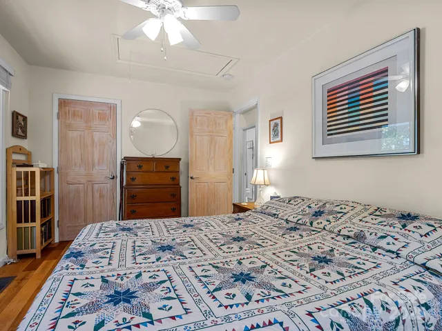 a bedroom with a bed and a dresser