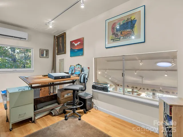 a view of a workspace with furniture