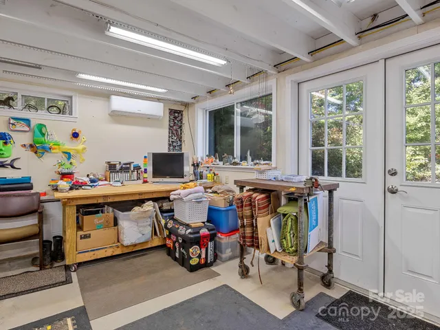a living room with lots of furniture and windows