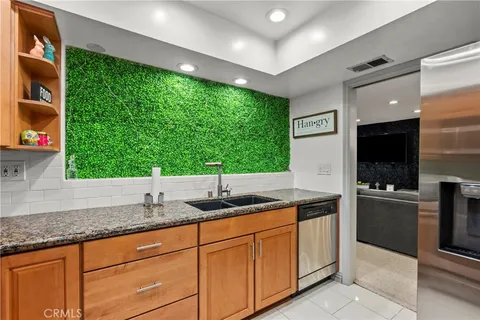 a bathroom with a sink mirror vanity and toilet