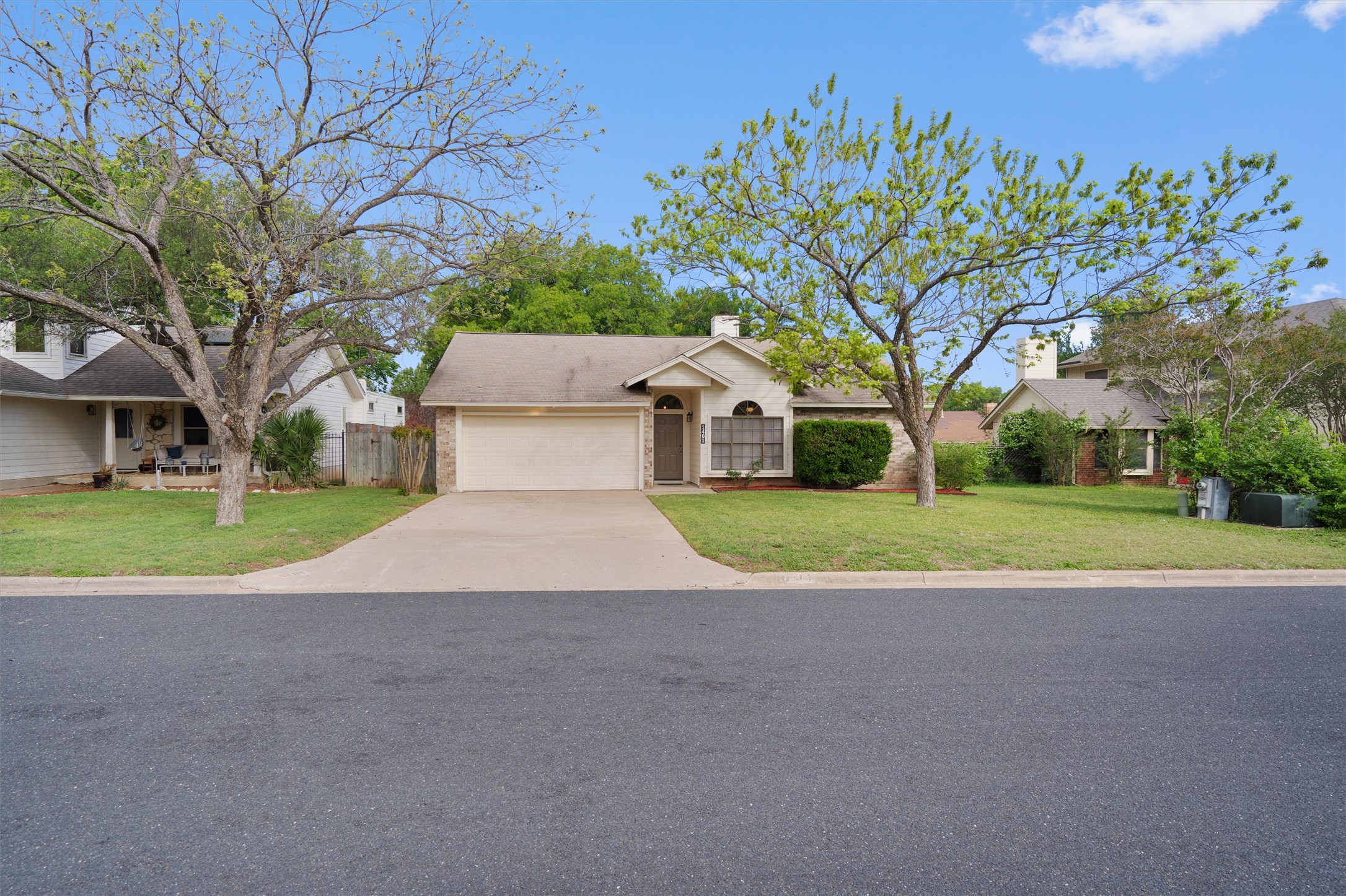 1401 Plum Creek Road Cedar Park, TX 78613 - Photo 2 of 30 Single story home with driveway, a garage, a chimney, and brick siding