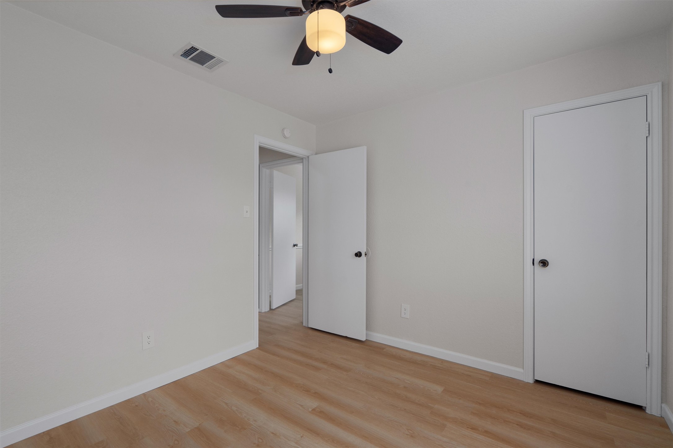 1401 Plum Creek Road Cedar Park, TX 78613 - Photo 19 of 30 Unfurnished bedroom with light wood-type flooring and ceiling fan