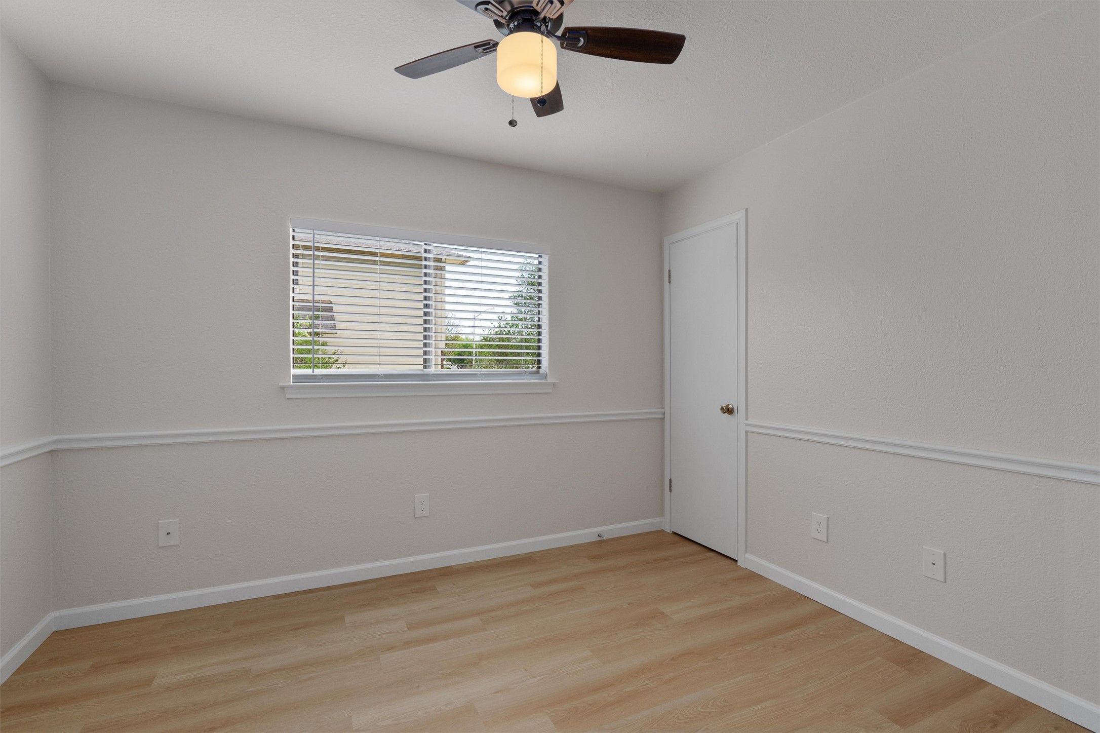 1401 Plum Creek Road Cedar Park, TX 78613 - Photo 20 of 30 Empty room featuring light wood finished floors and ceiling fan