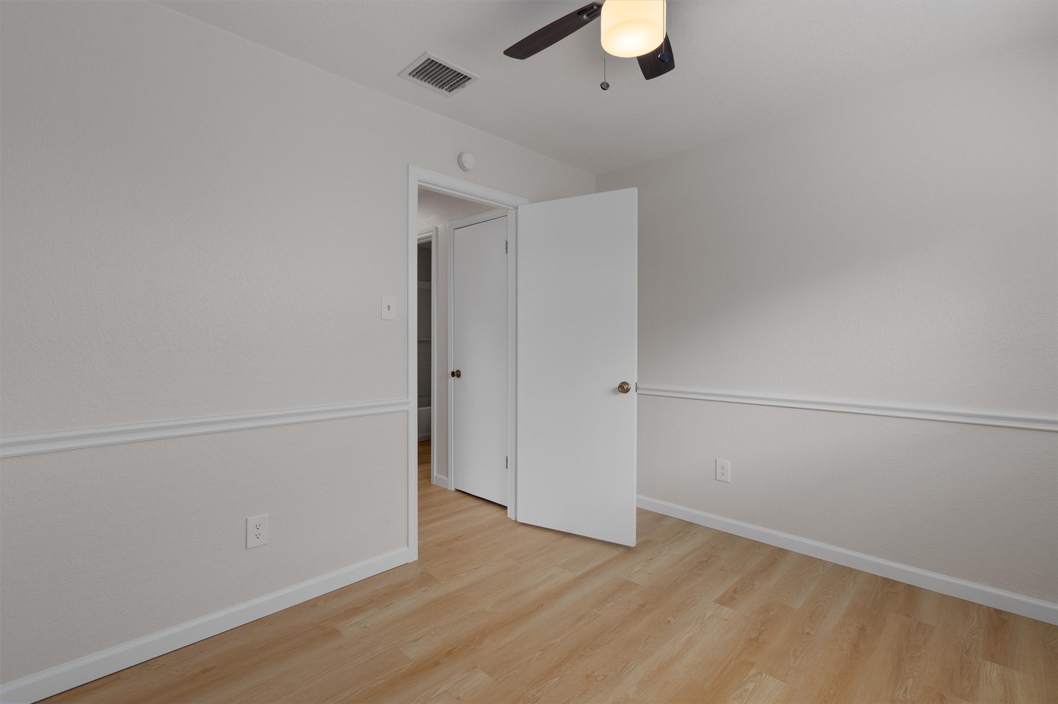 1401 Plum Creek Road Cedar Park, TX 78613 - Photo 21 of 30 Unfurnished bedroom with light wood-style flooring and ceiling fan