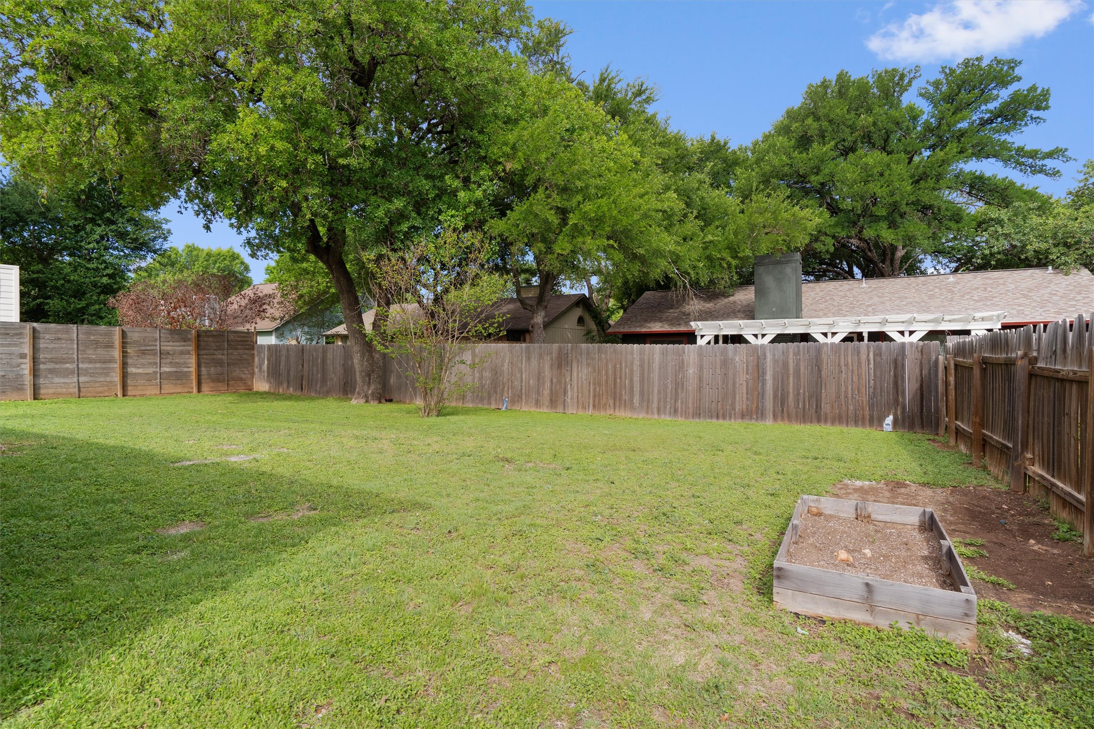1401 Plum Creek Road Cedar Park, TX 78613 - Photo 24 of 30 Fenced backyard featuring a vegetable garden