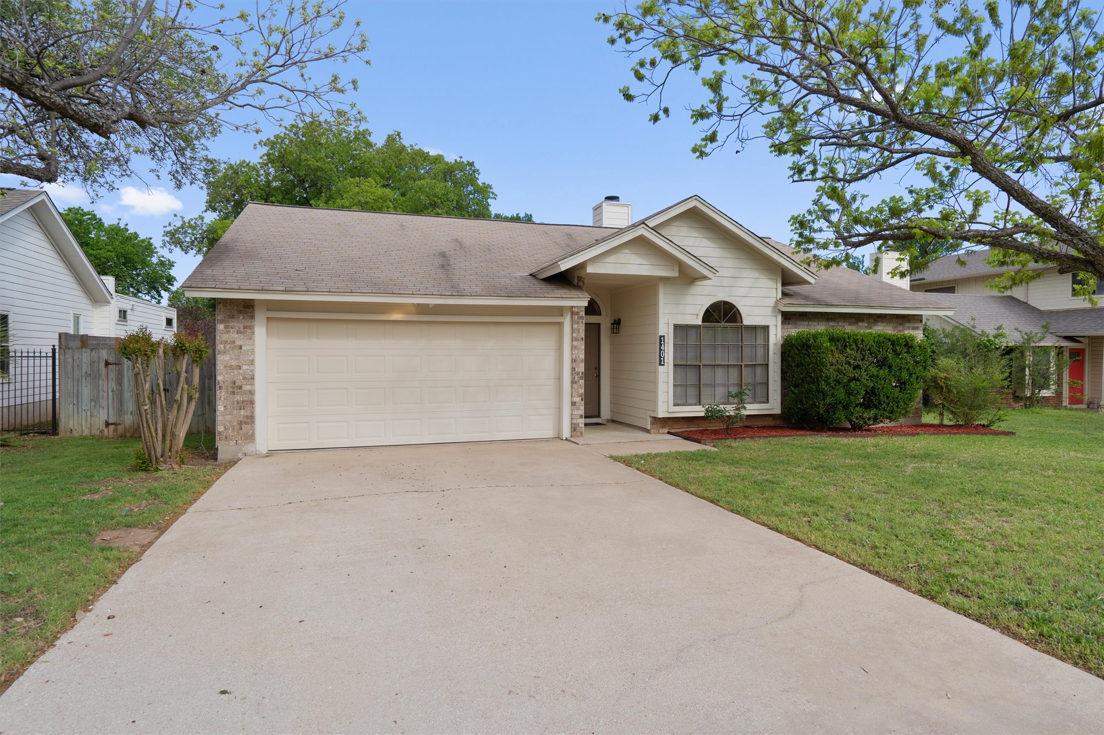 1401 Plum Creek Road Cedar Park, TX 78613 - Photo 3 of 30 Single story home featuring brick siding, a garage, concrete driveway, a chimney, and a shingled roof
