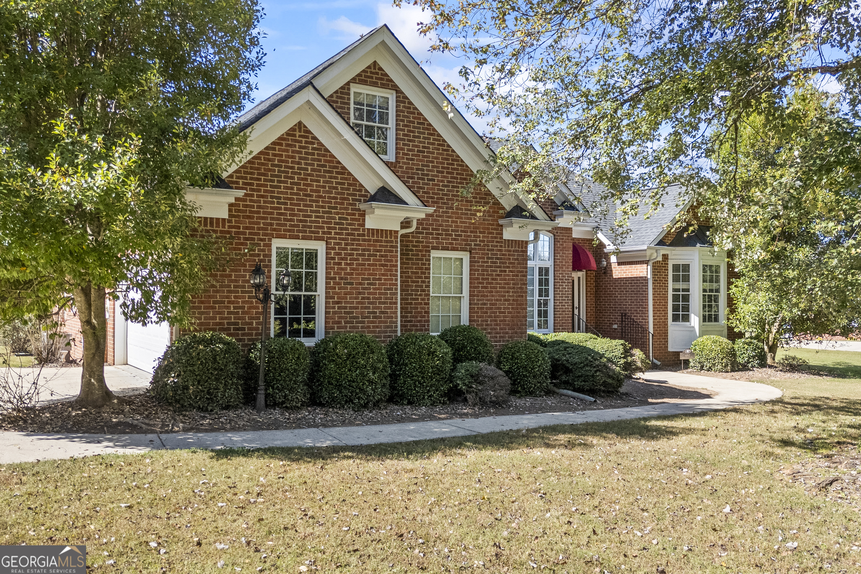 682 Chesterfield Road Bogart, GA 30622 - Photo 1 of 1 a front view of a house with garden