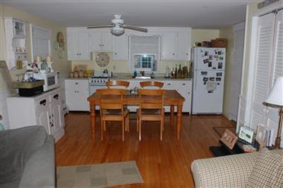 5 Forest Road Mashpee, MA 02649 - Photo 5 of 14 a living room with furniture dining table and wooden floor