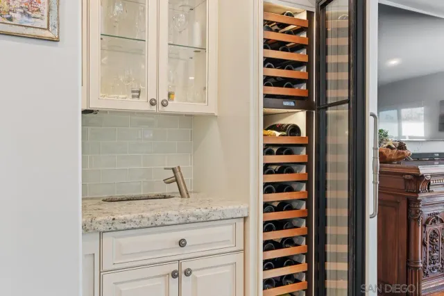 a kitchen with sink and cabinets