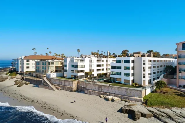 an aerial view of a house with a ocean view