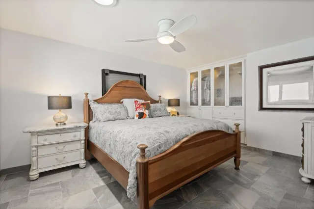a utility room with cabinets washer and dryer