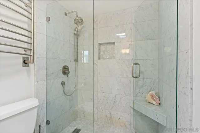 a building outdoor space with patio furniture and potted plants