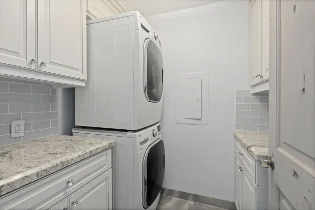 a utility room with washer and dryer