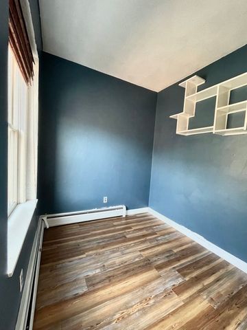 a view of a livingroom with wooden floor