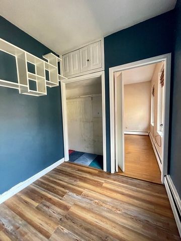 a view of livingroom with wooden floor