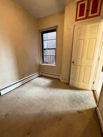 a large kitchen with stainless steel appliances granite countertop a stove a sink and a microwave