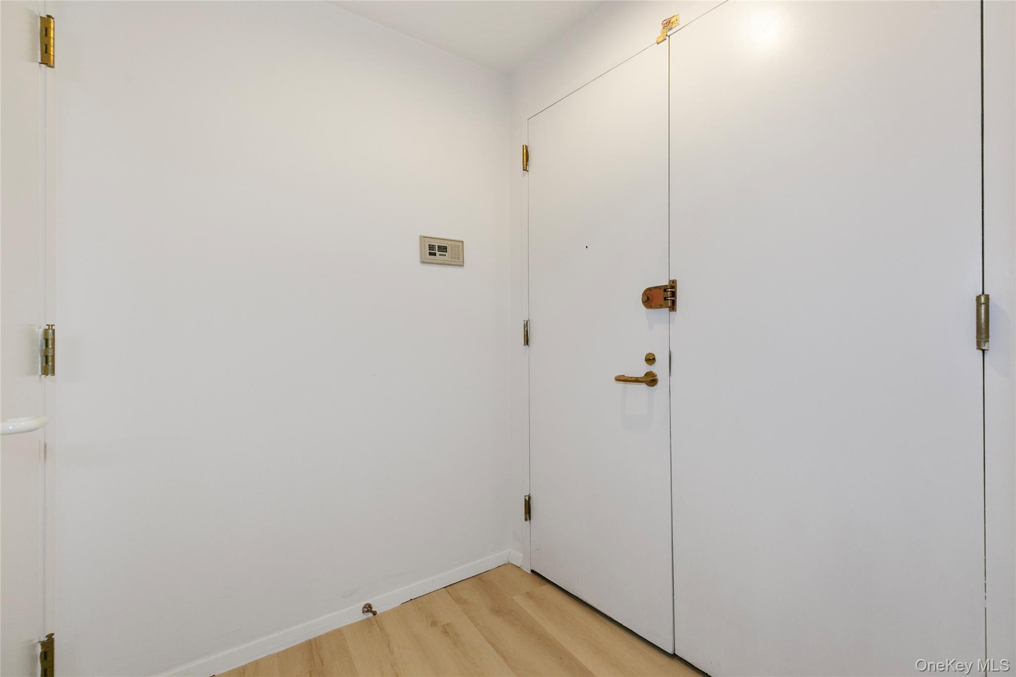 100 Cutter Mill Road, Unit 2C Great Neck, NY 11021 - Photo 7 of 29 a view of a room with wooden floor