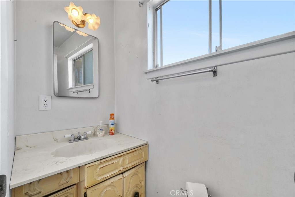 2551 Rome Avenue Anaheim, CA 92804 - Photo 14 of 27 a bathroom with a sink and a mirror