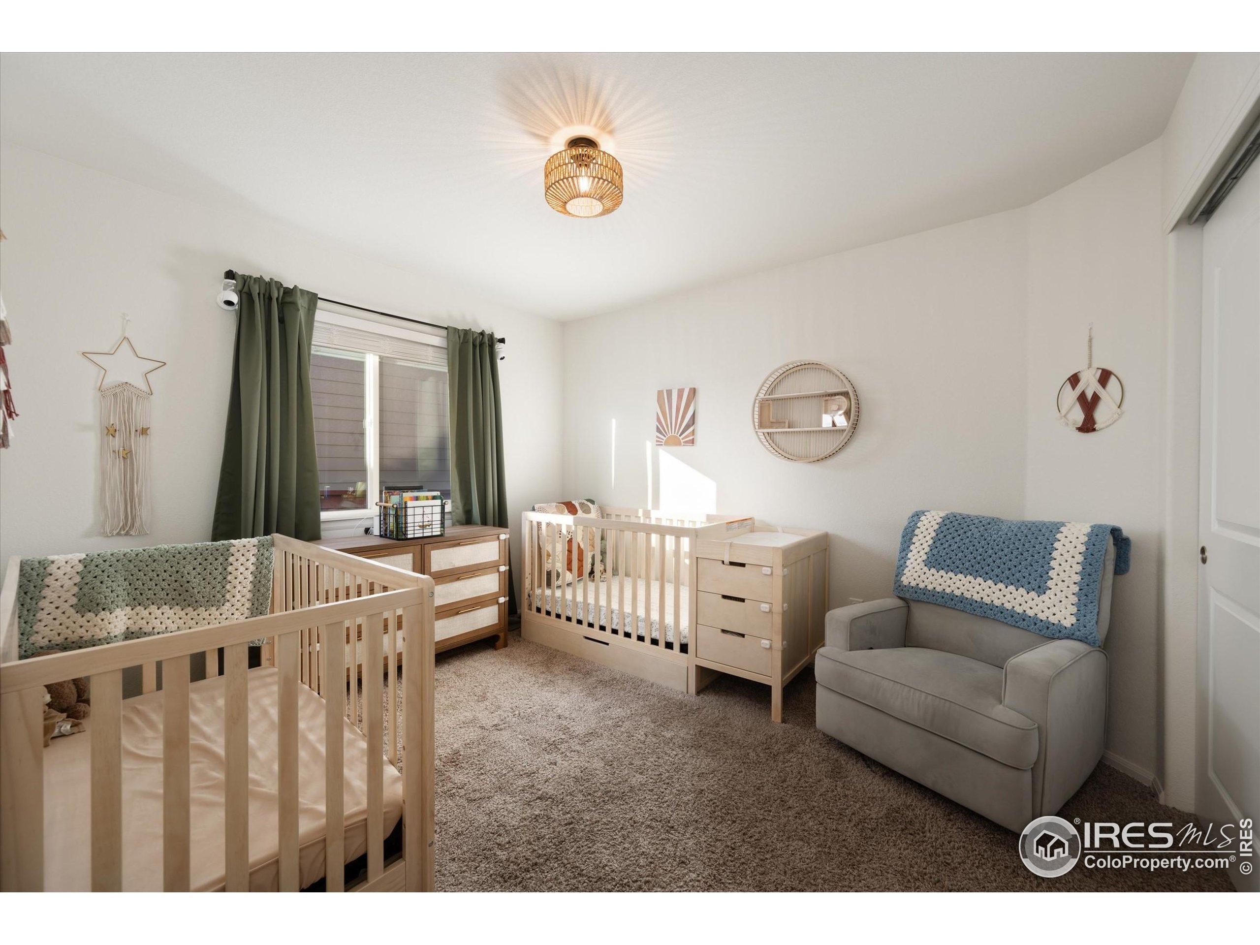 1995 Thundercloud Drive Windsor, CO 80550 - Photo 13 of 36 a living room with furniture and a large window