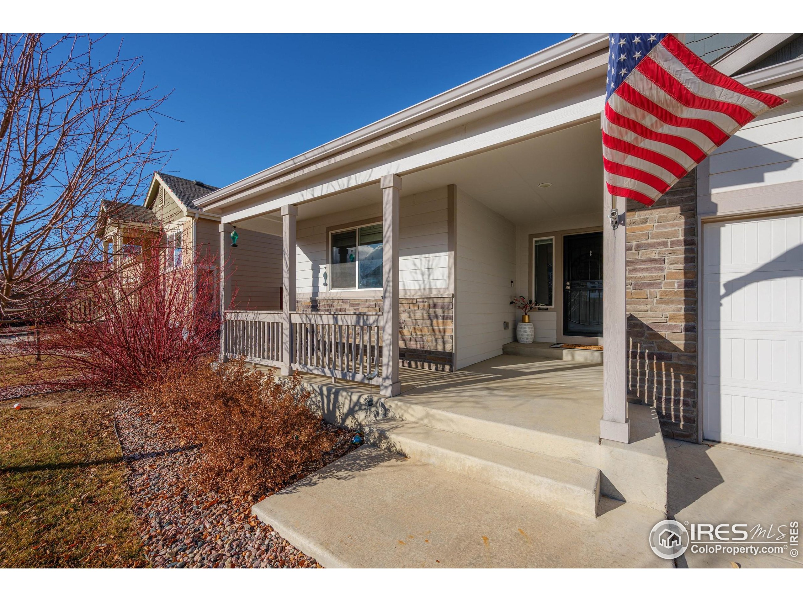 1995 Thundercloud Drive Windsor, CO 80550 - Photo 2 of 36 a front view of a house with a porch