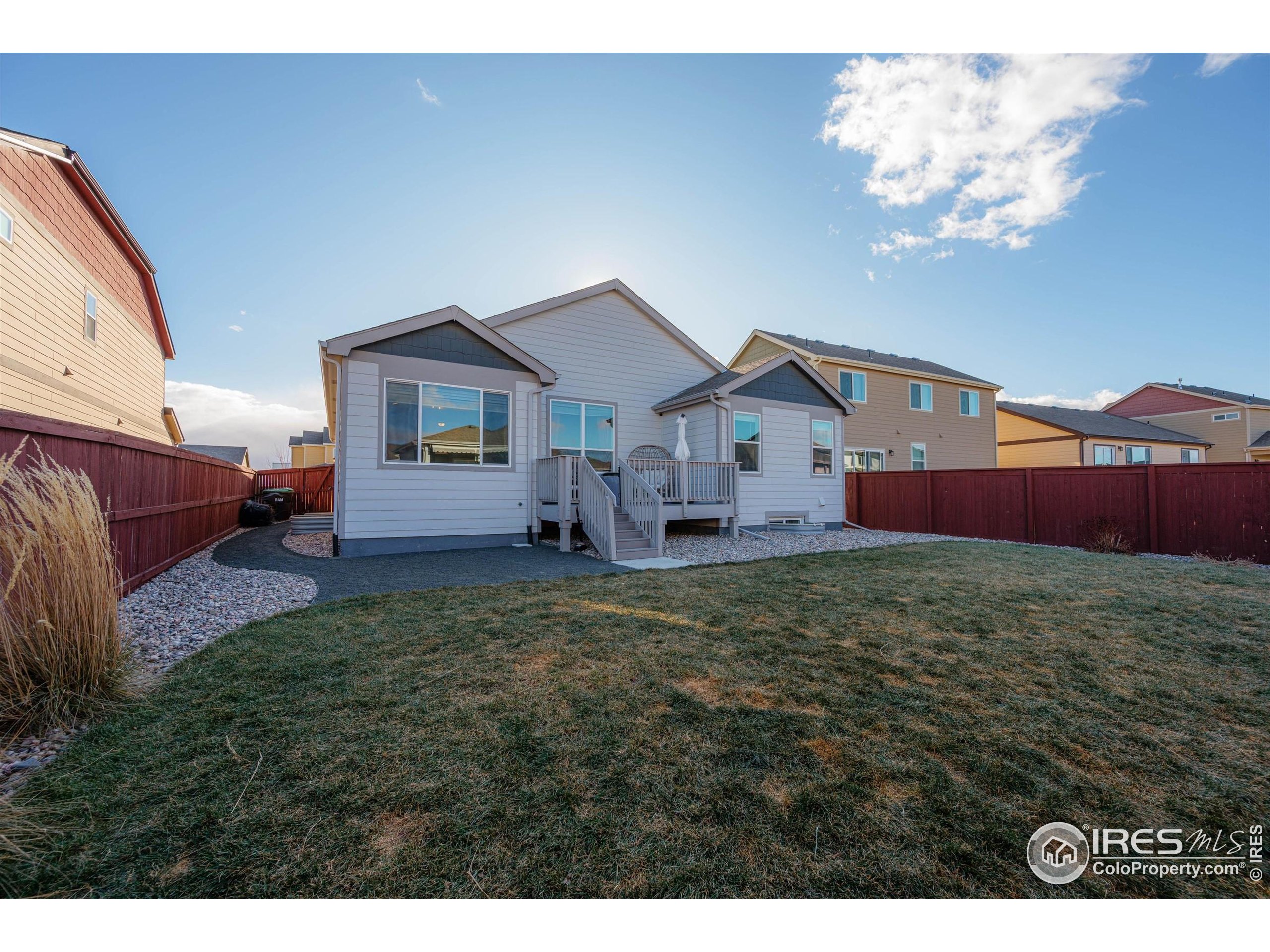 1995 Thundercloud Drive Windsor, CO 80550 - Photo 24 of 36 a view of a house with backyard