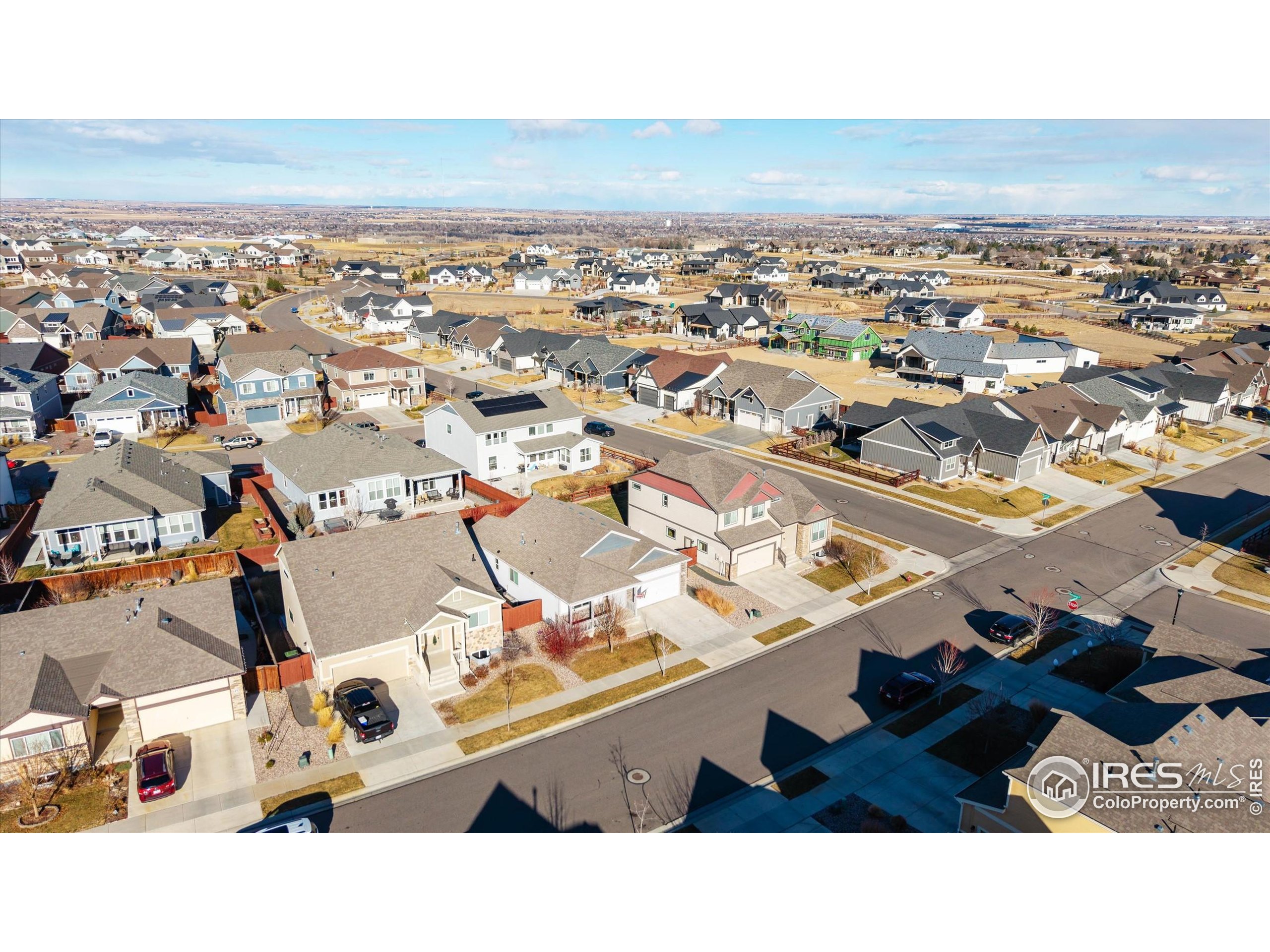 1995 Thundercloud Drive Windsor, CO 80550 - Photo 28 of 36 an aerial view of residential building and parking space