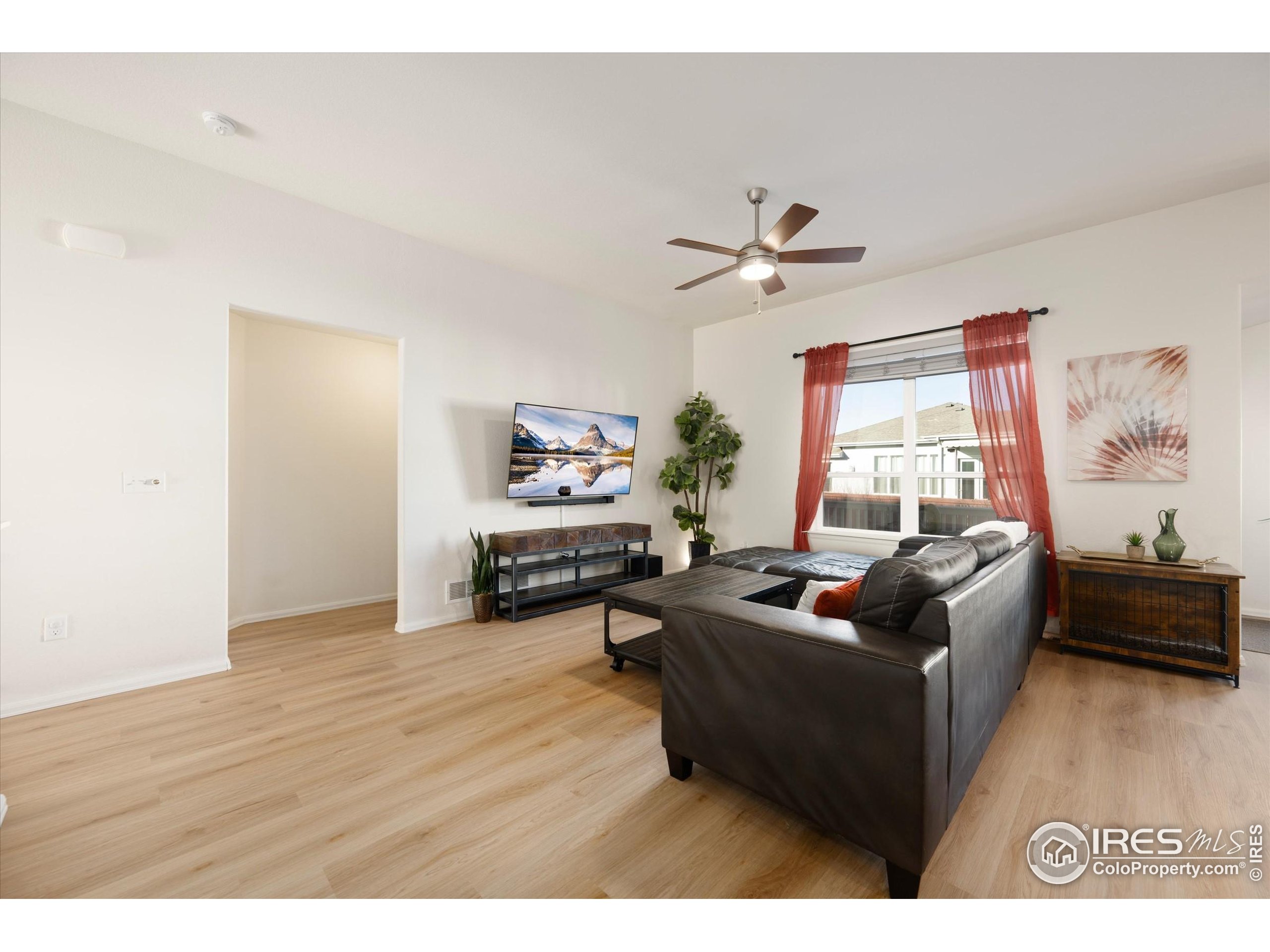 1995 Thundercloud Drive Windsor, CO 80550 - Photo 6 of 36 a living room with furniture and a large window