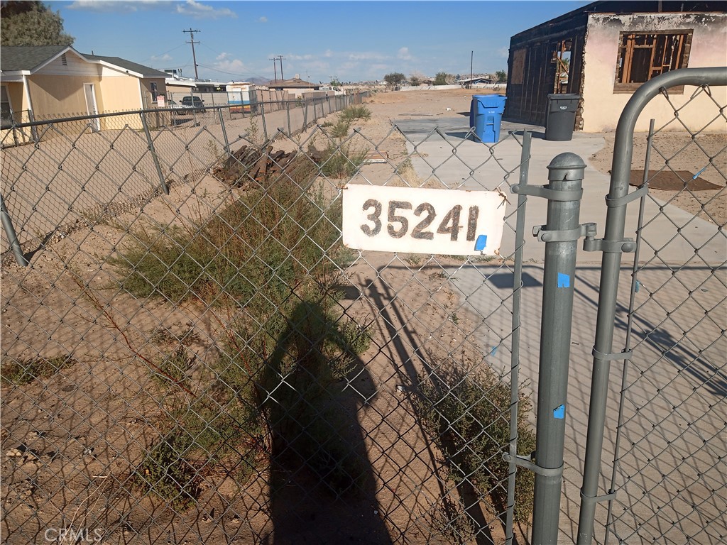 35241 Cedar Road Barstow, CA 92311 - Photo 2 of 3 a signage on a wall next to a building