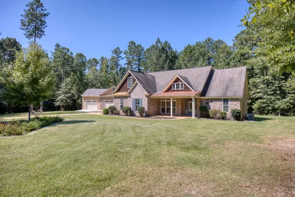 front view of a house with a yard