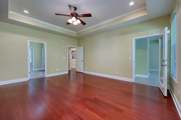 a spacious bathroom with a granite countertop sink and a mirror